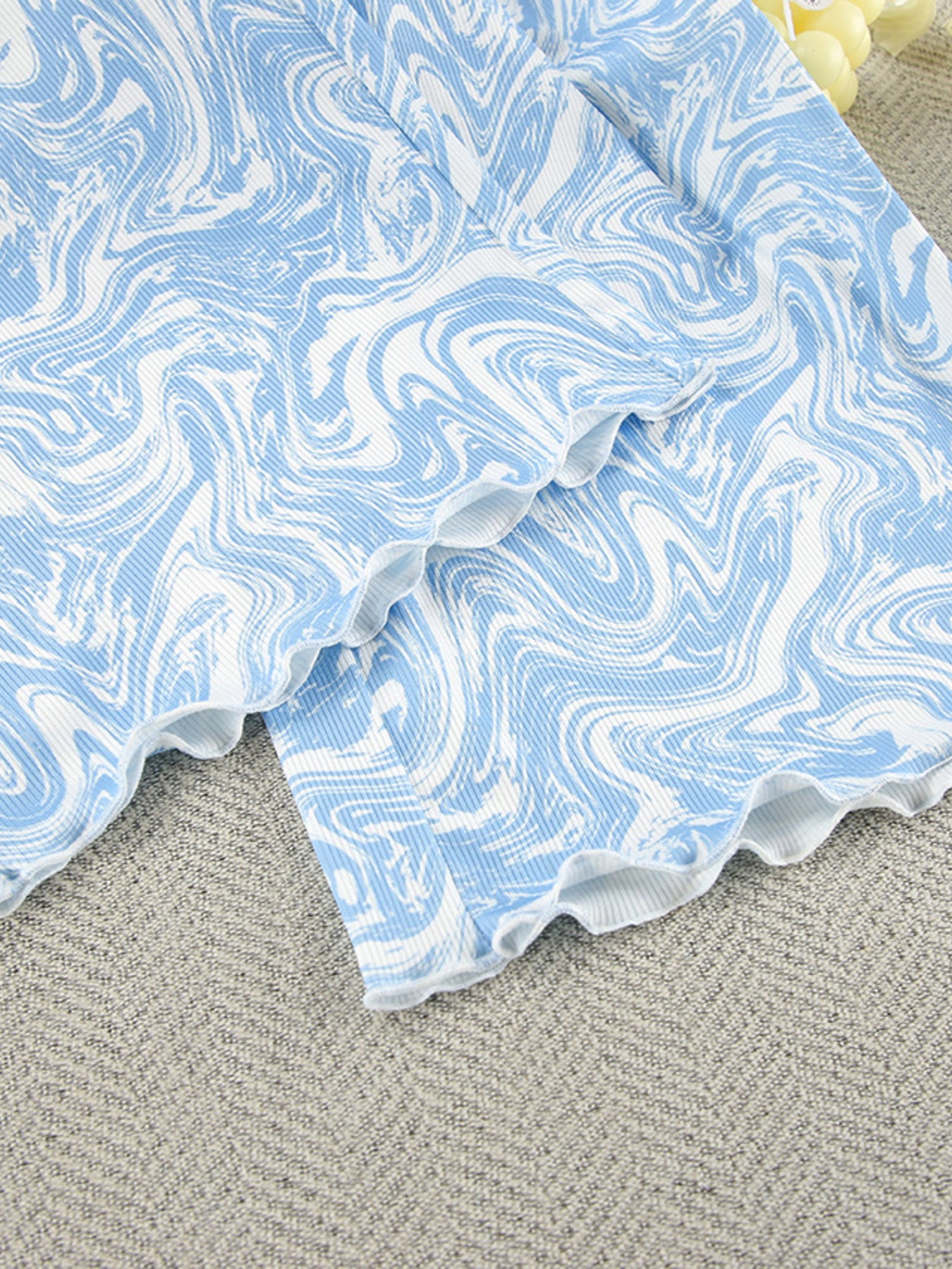 Close up of the Tie Front Long Sleeve Top and Pants Lounge Set, showing the blue and white swirl pattern