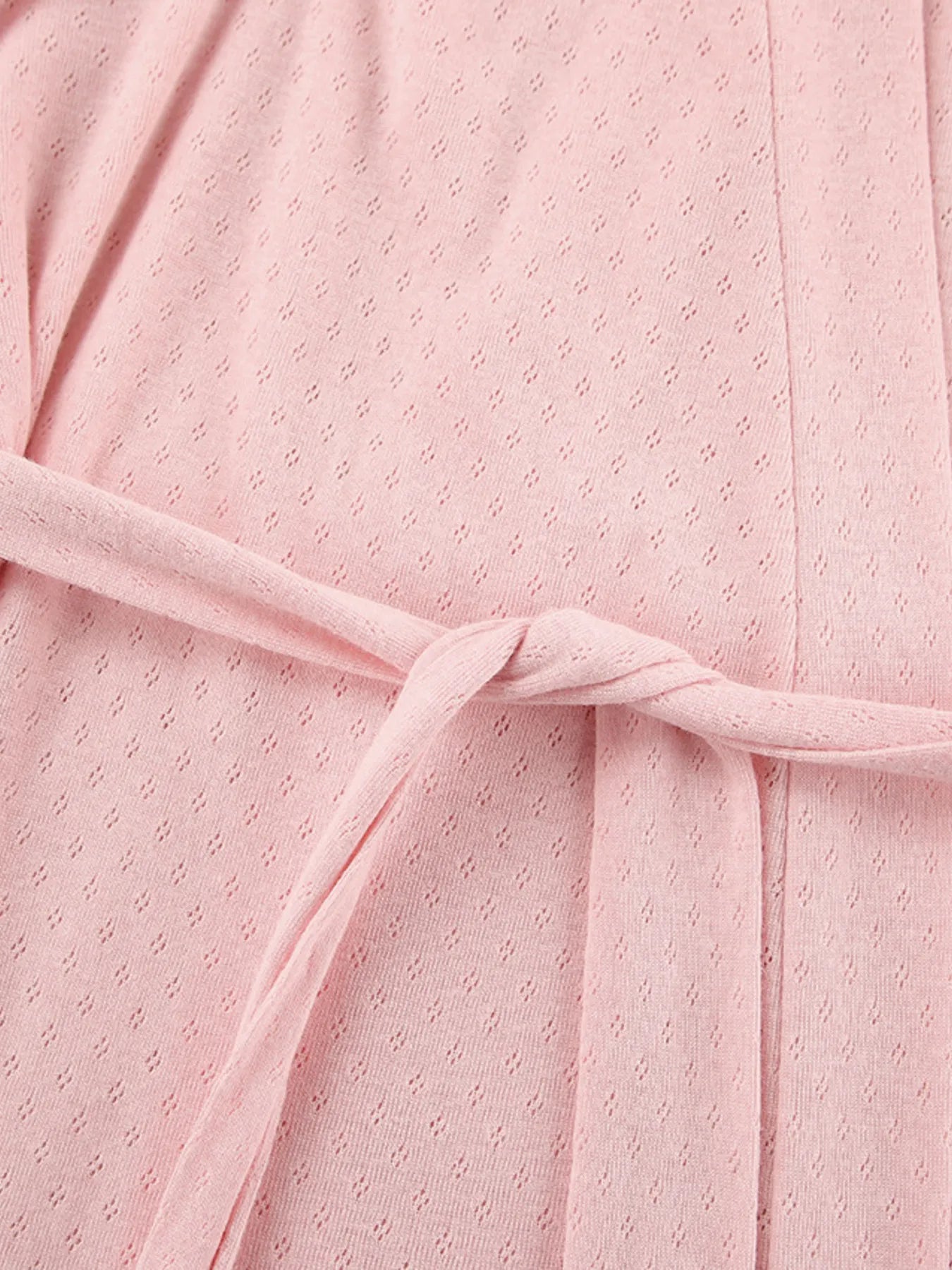 Close up of the pink Tie Waist Kimono Sleeve Lounge Nightgown fabric and tie