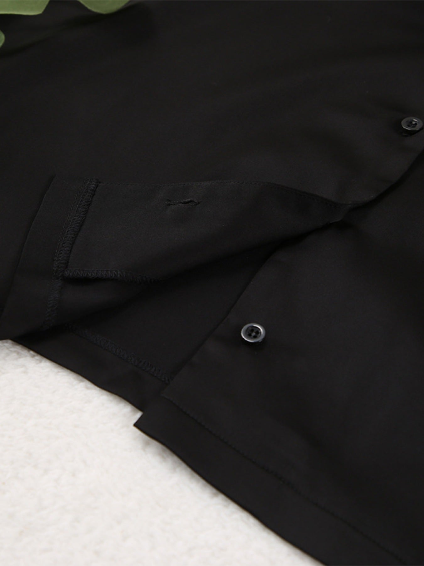 Close up of the black Long Sleeve Top and Wide Leg Pants Lounge Set fabric and button details