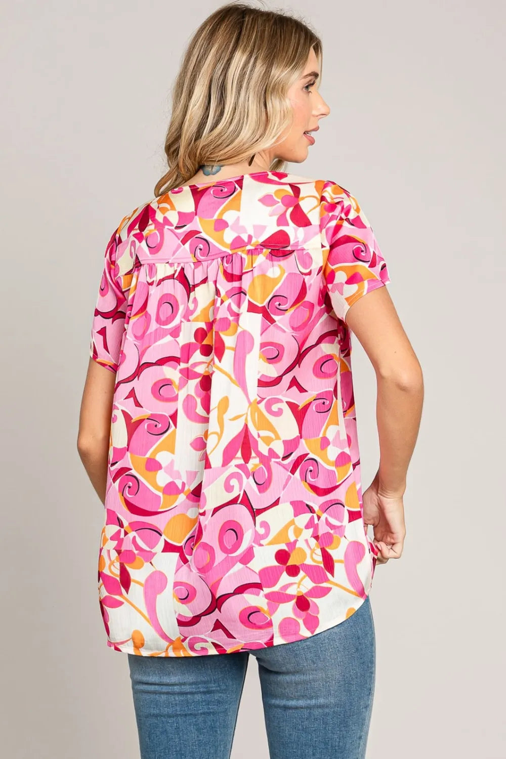 Abstract Print Short Sleeve Top with pink, orange, and white patterns