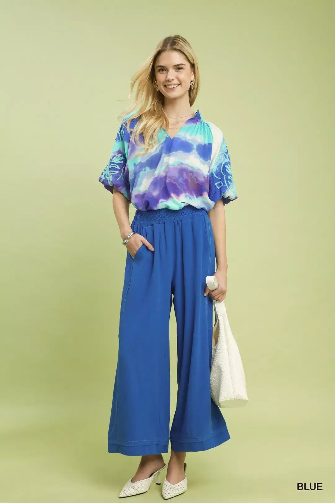 Woman wearing Cobalt Horizon Elastic-Waist Wide-Leg Pants and a tie-dye top