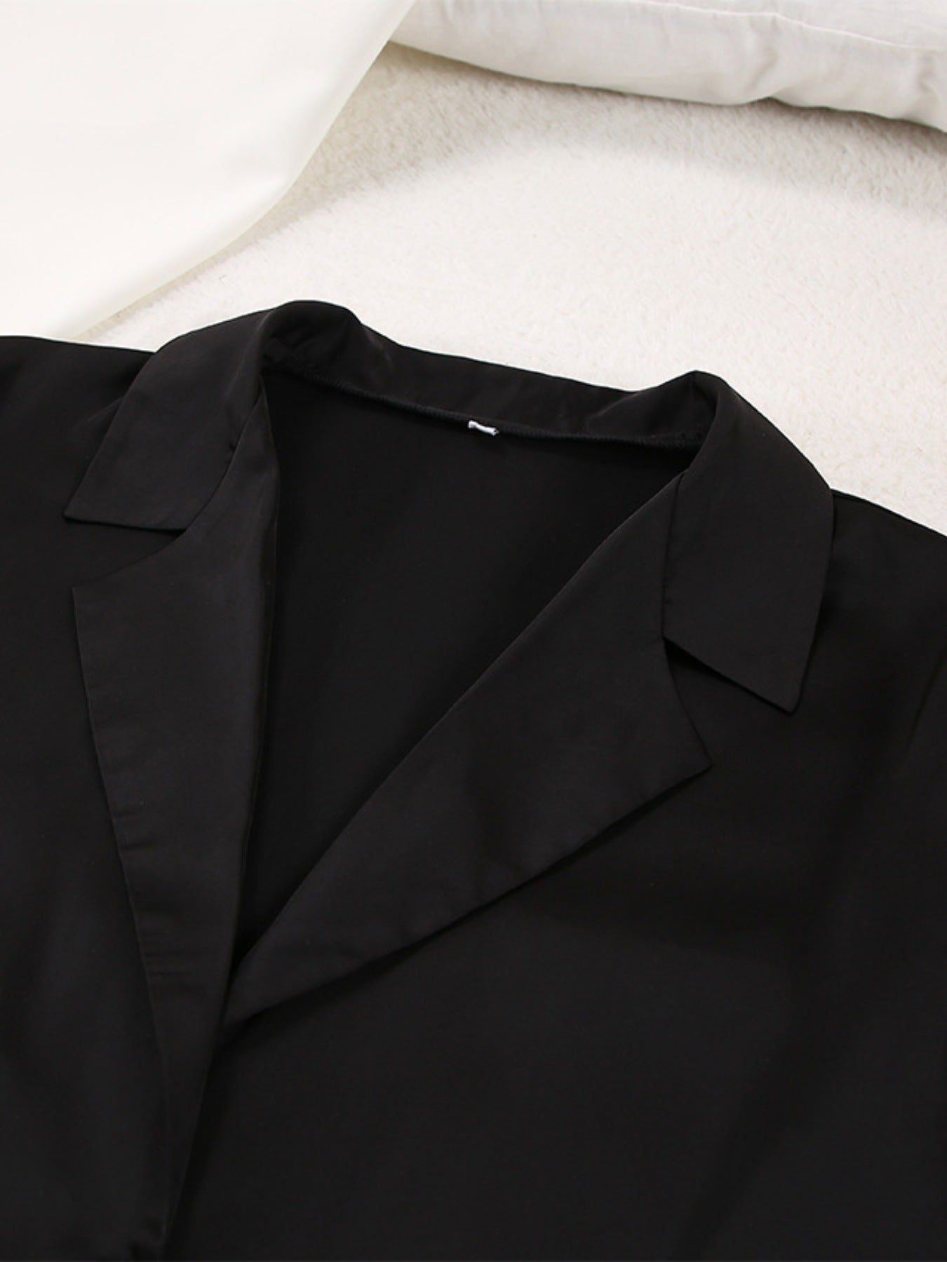 Close up of the collar and lapel of the black Long Sleeve Top and Wide Leg Pants Lounge Set