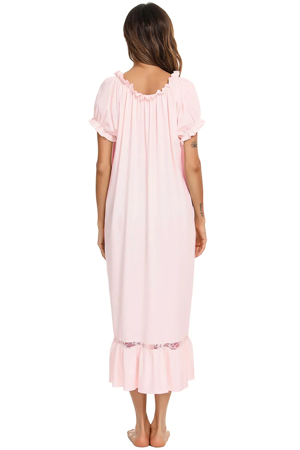 Back view of a woman wearing a pink Lace Detail Short Sleeve Lounge Dress with ruffled neckline and hem