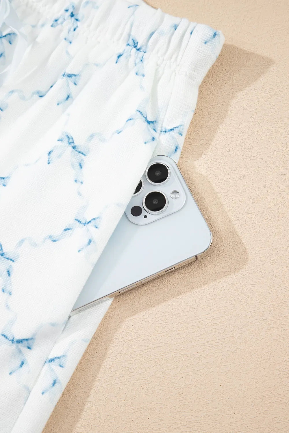 Printed Round Neck Top and Shorts Two-Piece Lounge Set with a phone in the pocket