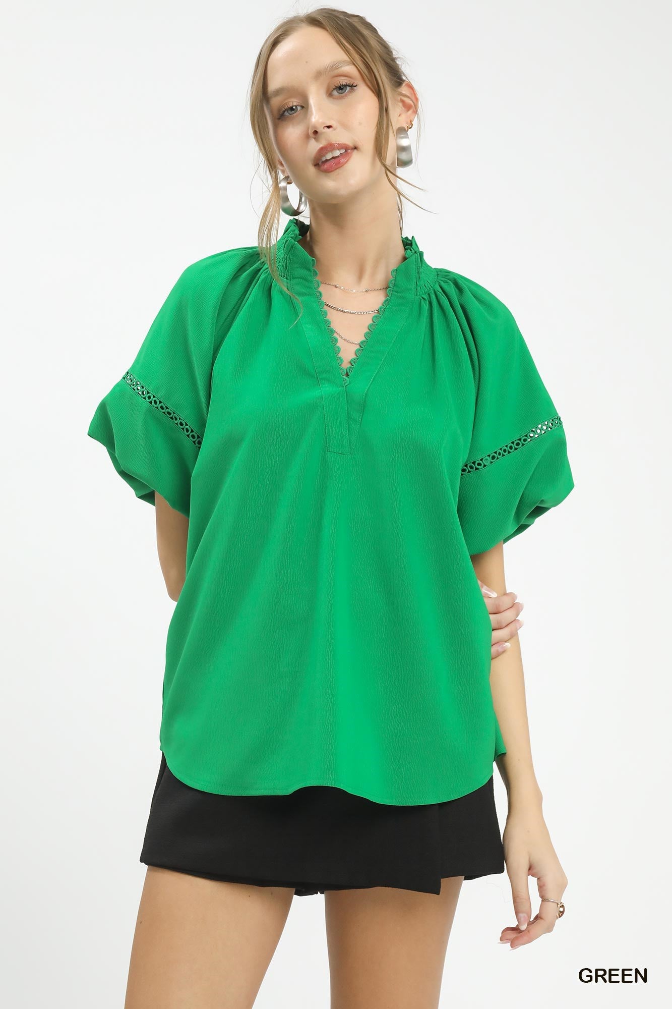 Umgee Lace Trim Peasant Top in green with short sleeves and black shorts