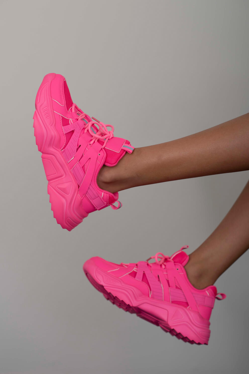 Running Late Chunky Sole Sneakers in Hot Pink on a model