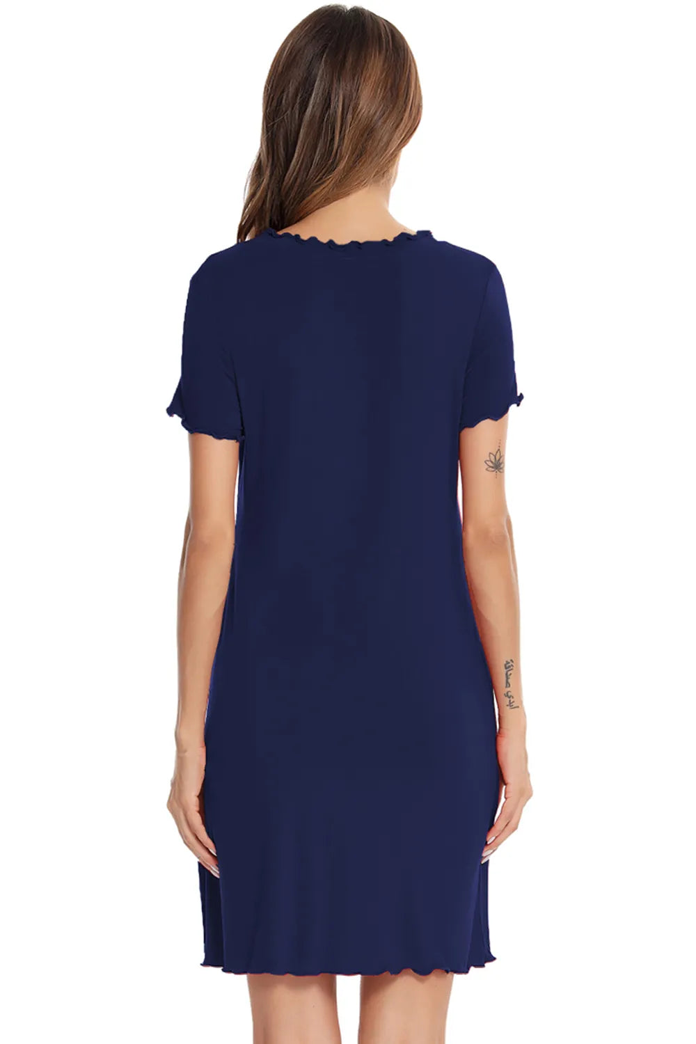 Back view of a woman wearing a navy blue Round Neck Short Sleeve Lounge Dress with ruffled edges