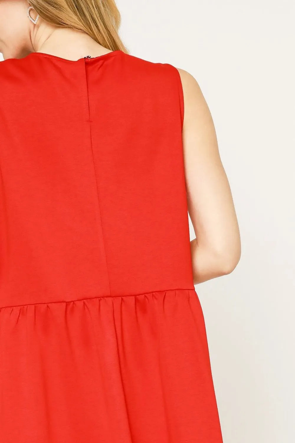 Back view of a woman wearing a red Round Neck Sleeveless Tank Dress with Pockets