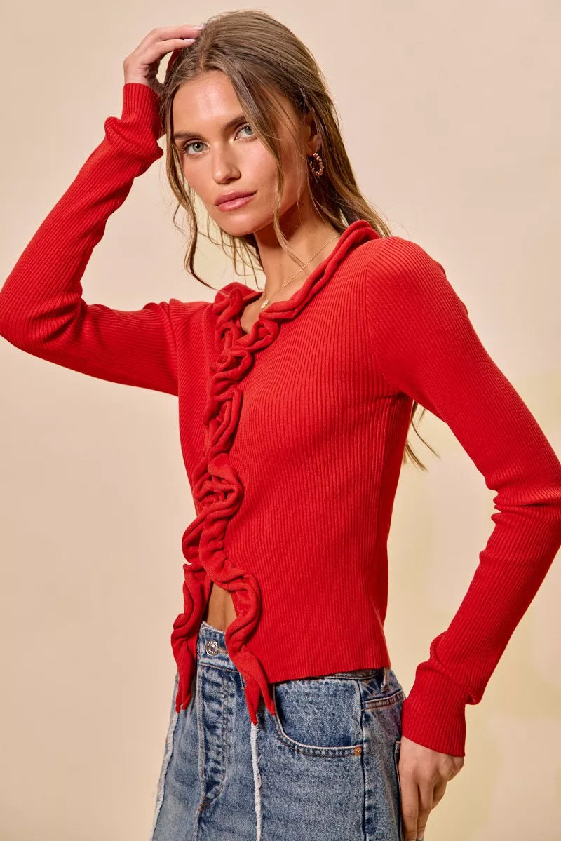 SO ME Cascade Ruffle Ribbed Sweater Cardigan in red with long sleeves and blue jeans