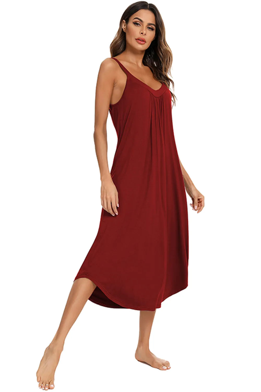 V-Neck Midi Lounge Dress in red, worn by a woman with long brown hair, standing with one leg raised