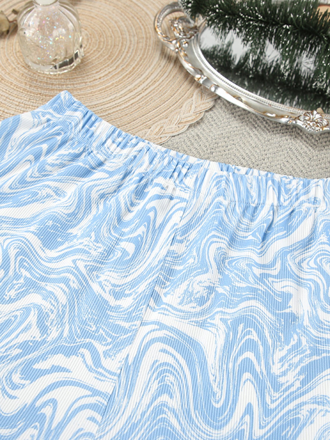 Close up of the Tie Front Long Sleeve Top and Pants Lounge Set, showing the blue and white swirl pattern