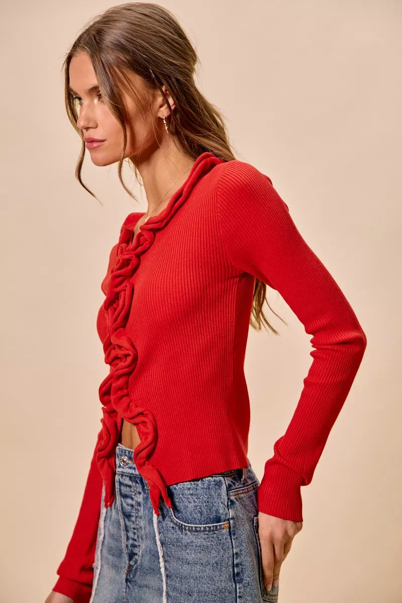SO ME Cascade Ruffle Ribbed Sweater Cardigan in red with long sleeves and denim jeans