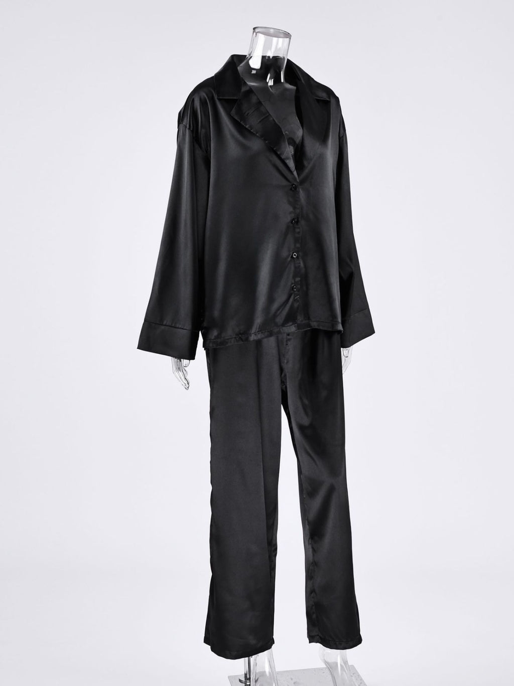 Long Sleeve Top and Wide Leg Pants Lounge Set in black satin on a mannequin