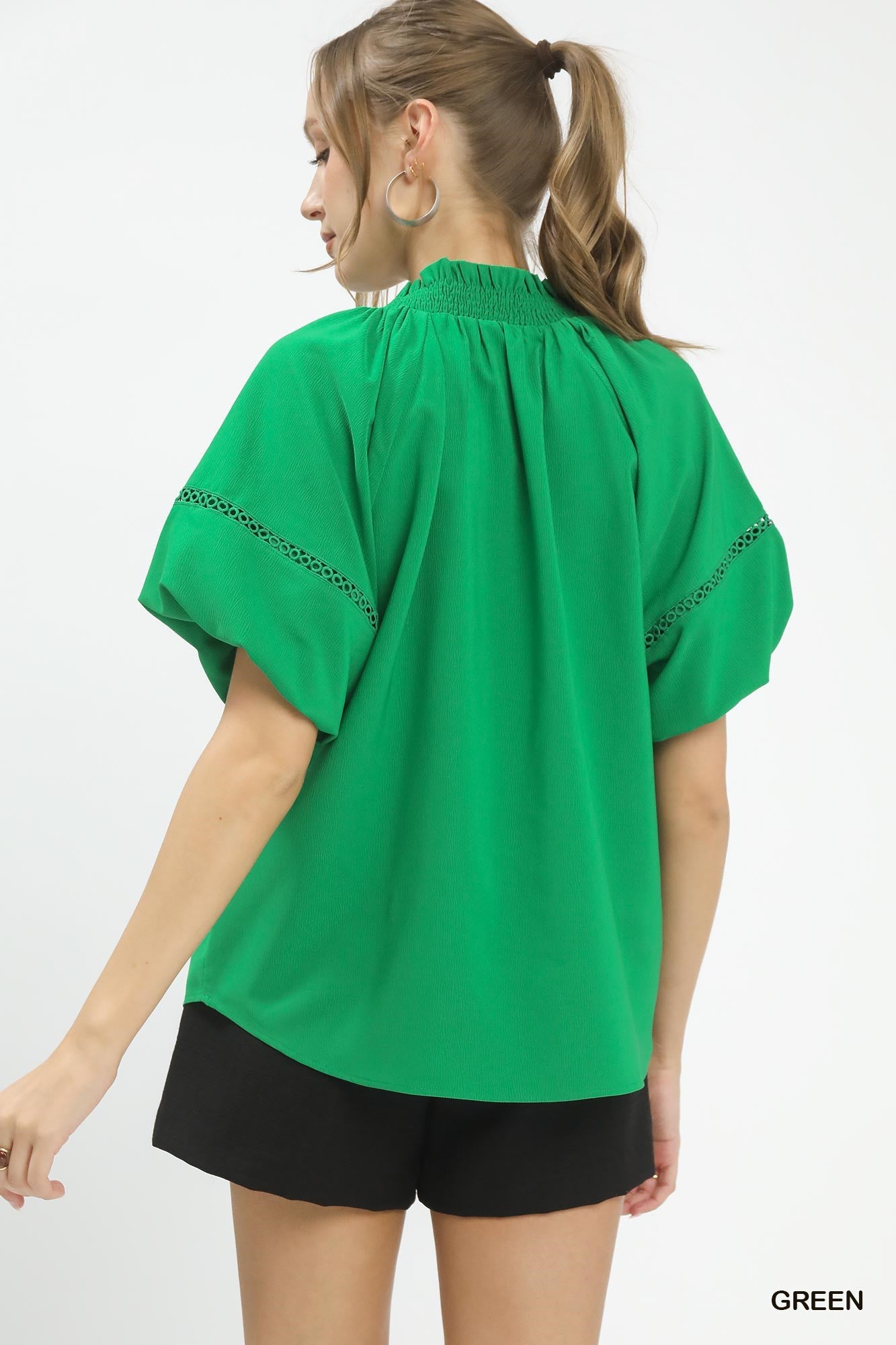 Umgee Lace Trim Peasant Top in green, back view