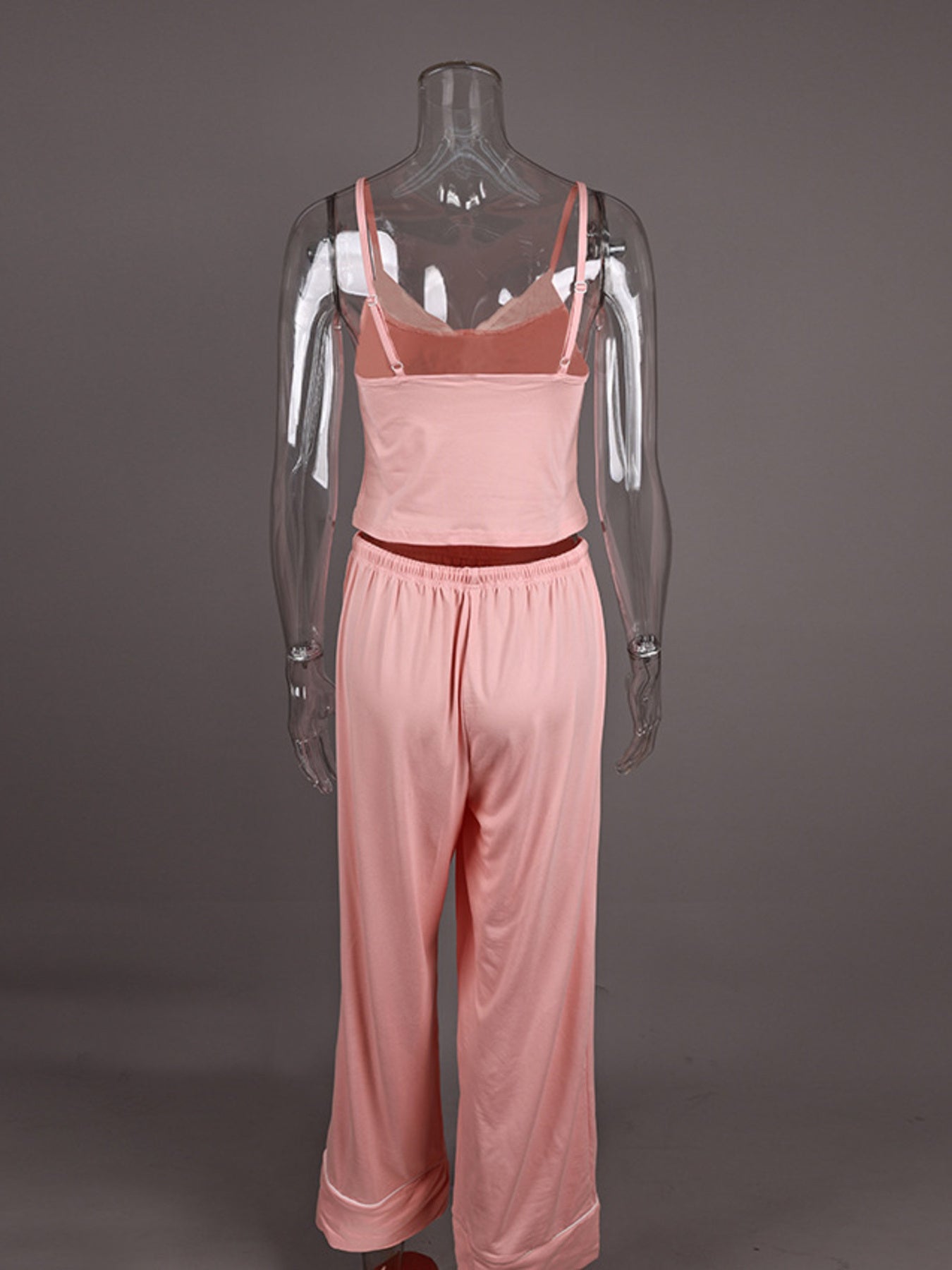 Back view of a pink Lace Trim Cami & Pants Lounge Set on a clear mannequin