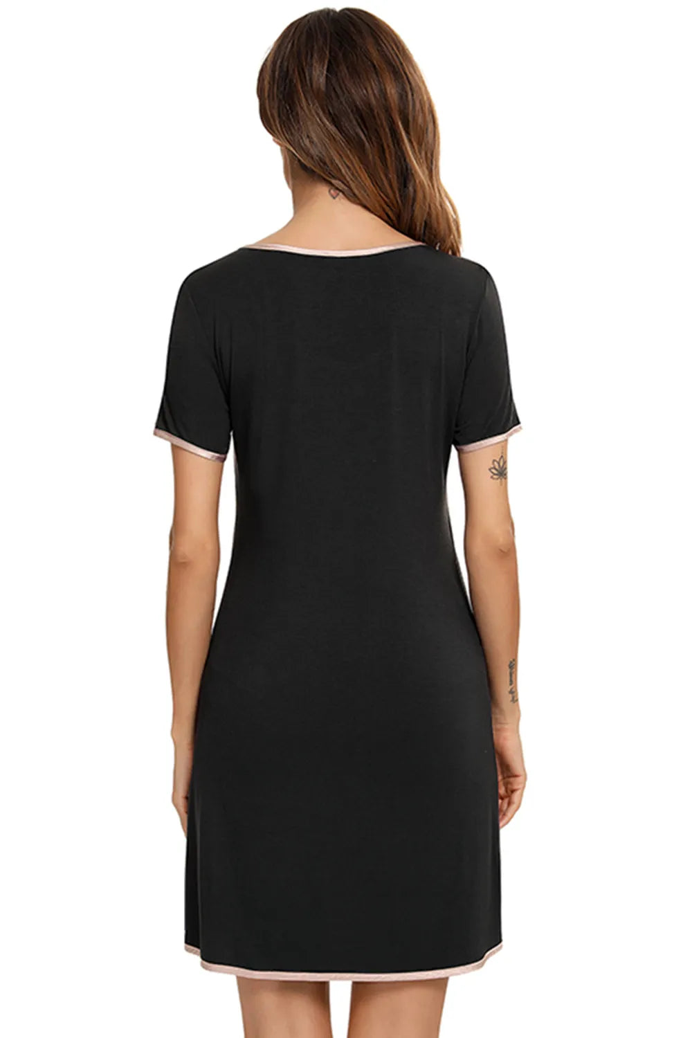 Back view of a woman wearing a black Contrast Trim Pocketed Round Neck Lounge Dress with pink trim