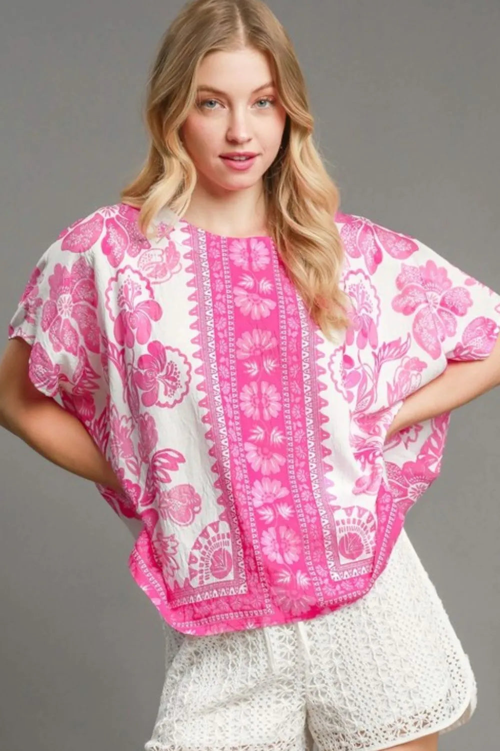 Umgee Floral Border Print Oversized Top Plus Size in pink and white with a blonde model