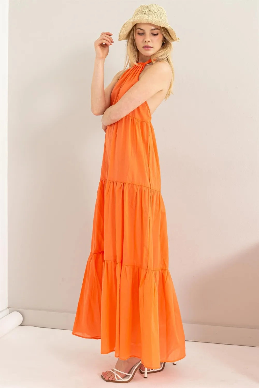 HYFVE Halter Neck Cover Up Maxi Dress in orange with a straw hat and white heels