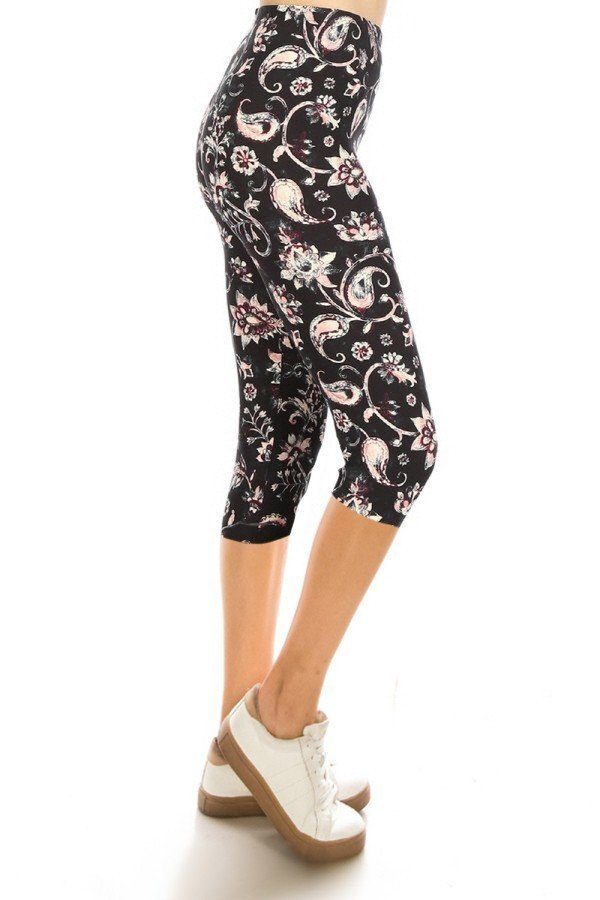 Printed Capri Leggings with a black background and a white and pink floral pattern