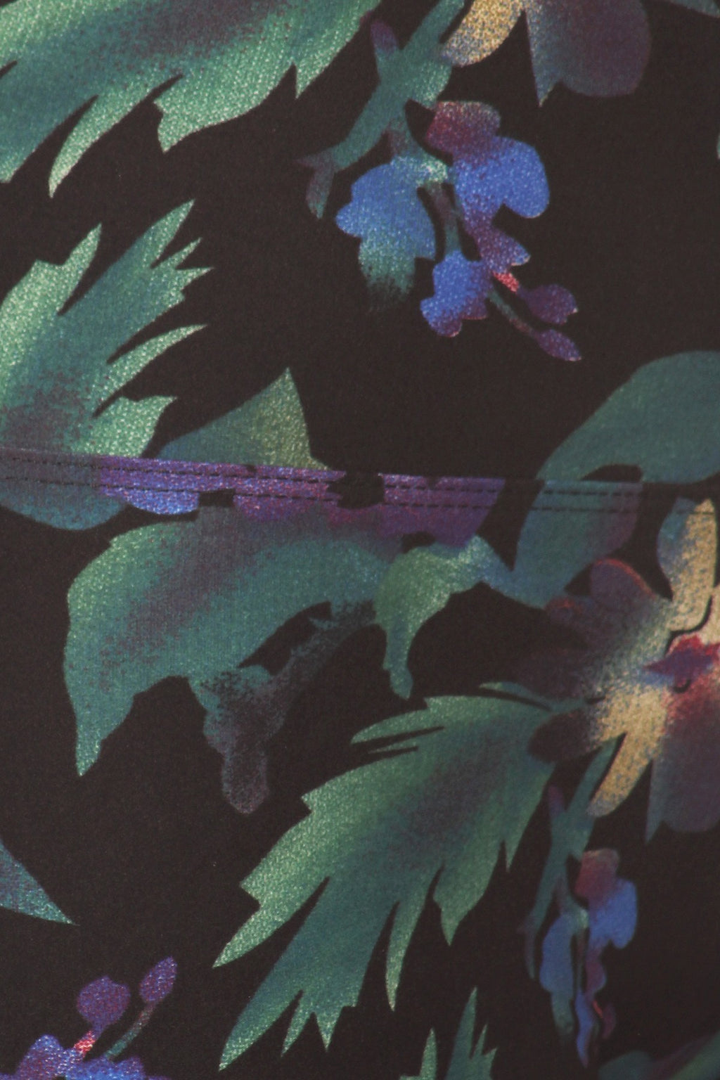 Close-up of Floral Print High-Waist Yoga Leggings, showing green leaves and blue and purple flowers