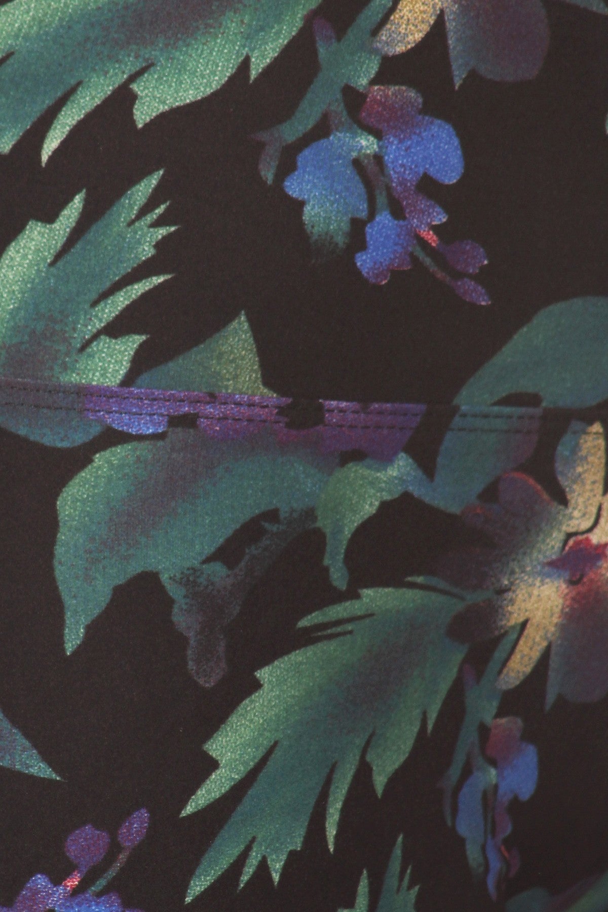 Close-up of Floral Print High-Waist Yoga Leggings, showing green leaves and blue and purple flowers