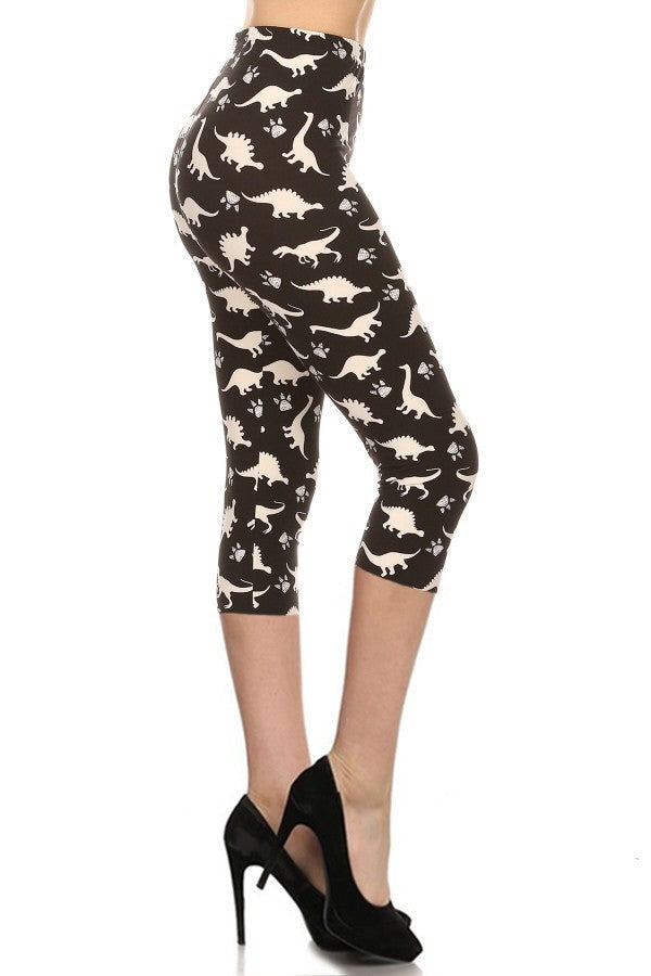 Dinosaur Print High-Waist Capri Leggings in black with white dinosaur and footprint pattern