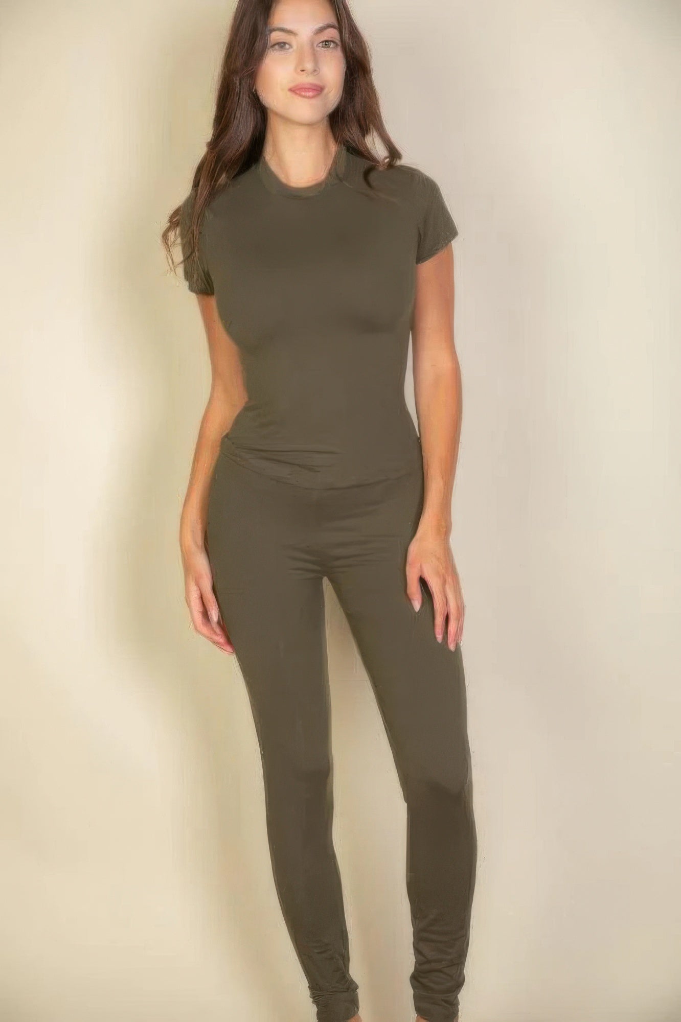 Woman wearing olive basic solid leggings and matching short-sleeved top