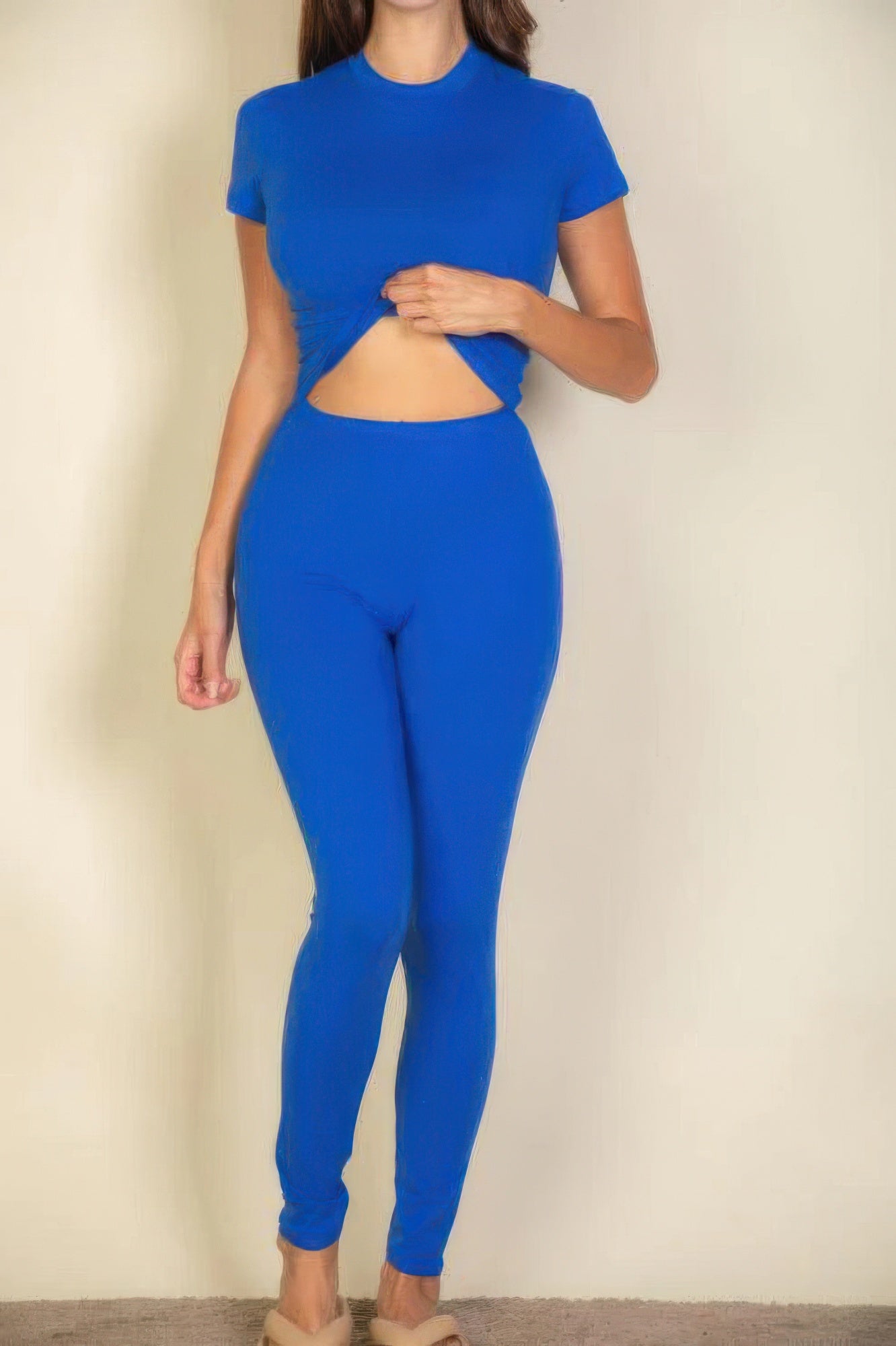 Woman wearing blue basic solid leggings and a matching short-sleeved top