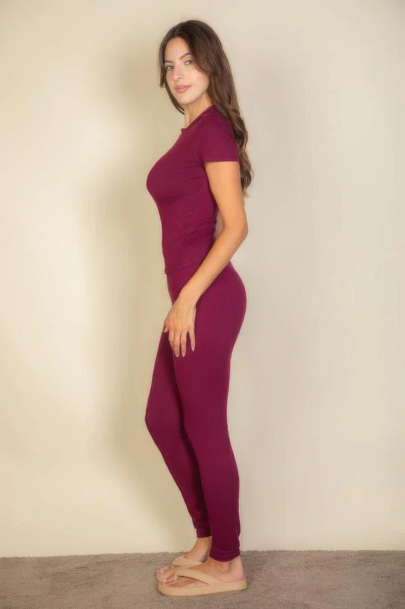 Woman in profile wearing Burgundy Basic Solid Leggings and matching short-sleeve top