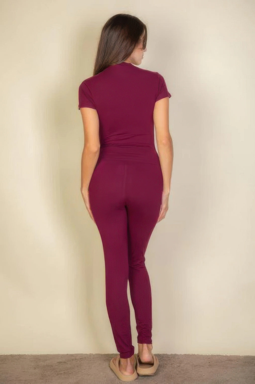 Woman from behind wearing Burgundy Basic Solid Leggings and a matching short-sleeved top