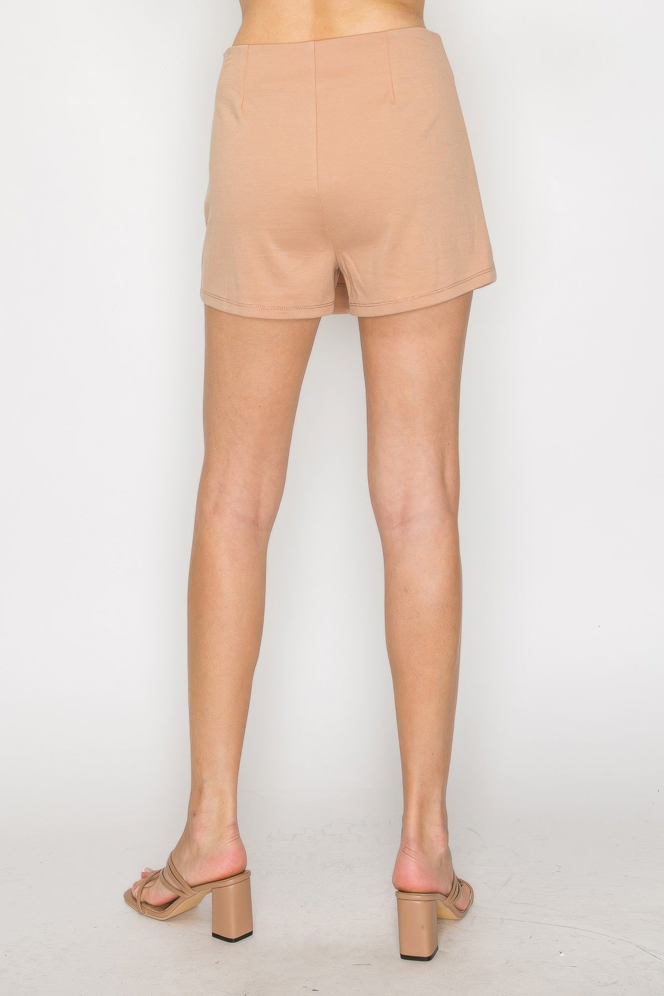 Soft Camel Wrap Skort with a flat front and a wrap detail, shown from the back