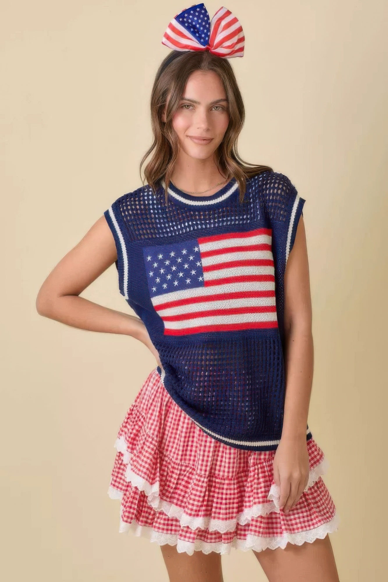 Woman in a blue American flag top and a red and white gingham tiered ruffle skort