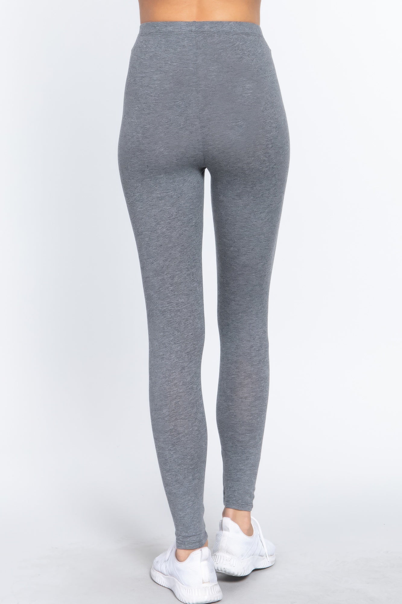 Rear view of model wearing Grey Cotton Spandex Leggings and white athletic shoes