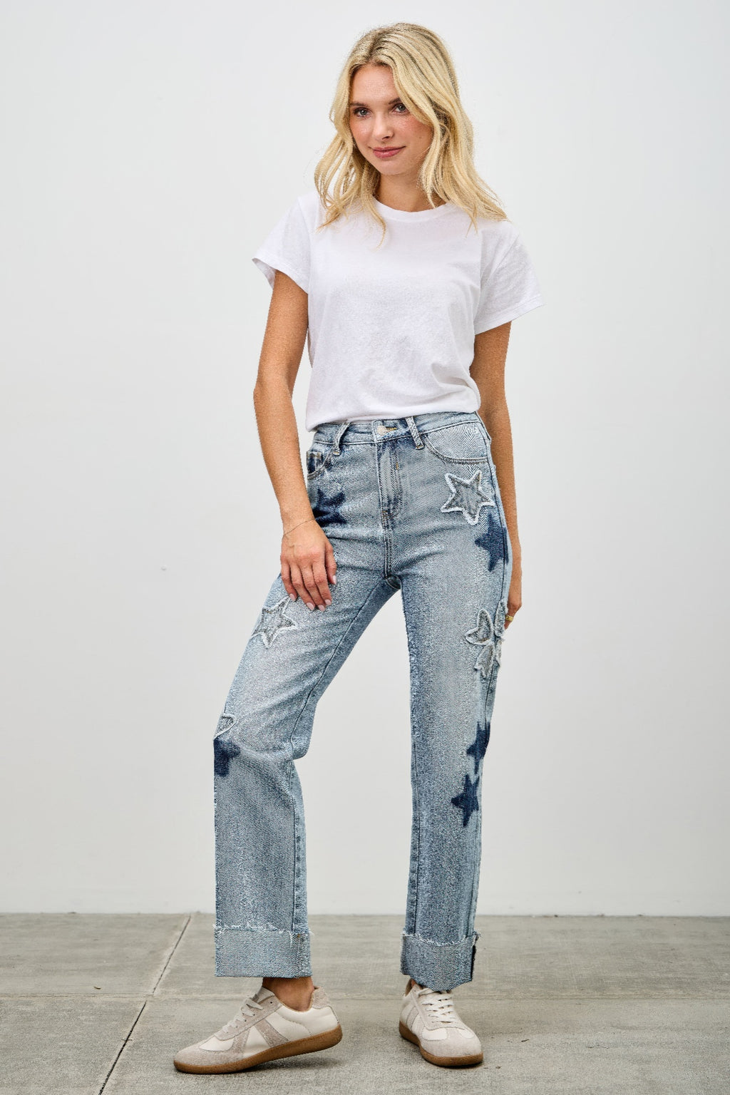 Blonde woman wearing High Rise Star & Heart Patched Dad Jeans with Stretch and a white t-shirt