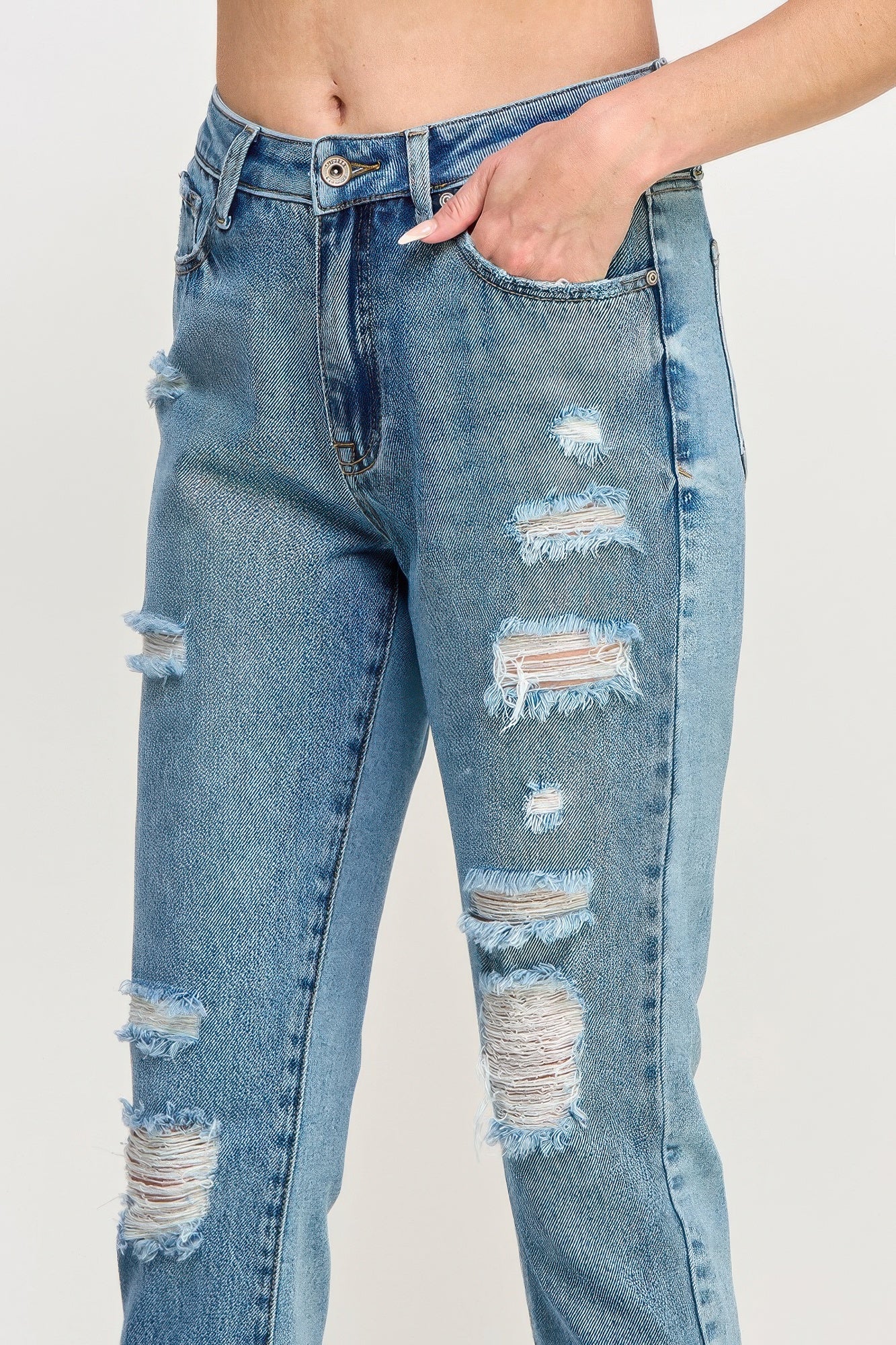 High Rise Distressed Relaxed Straight Jeans with a hand in the pocket