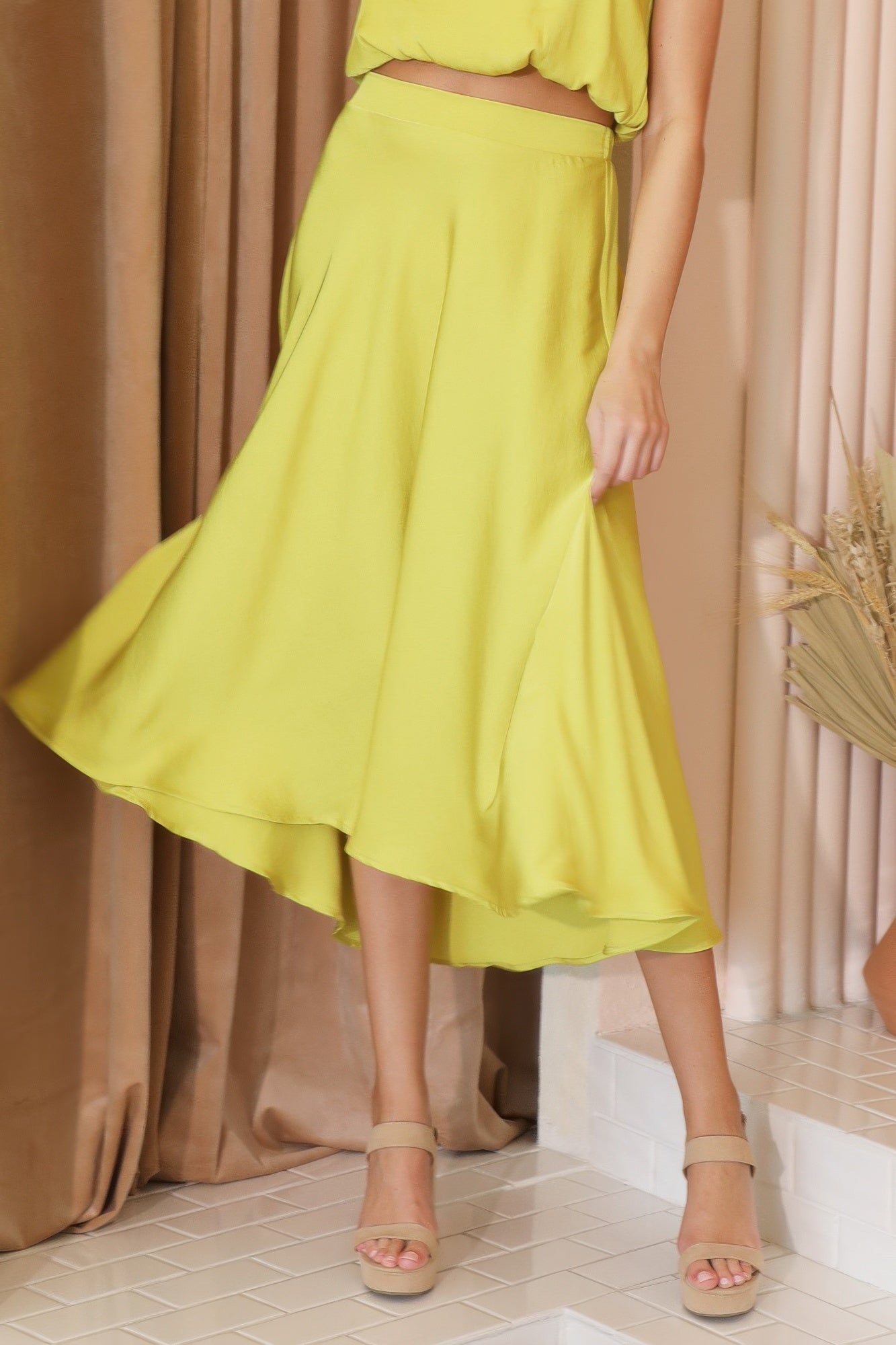Sunlit Marigold Fluid A-Line Midi Skirt with a matching crop top and nude wedge sandals