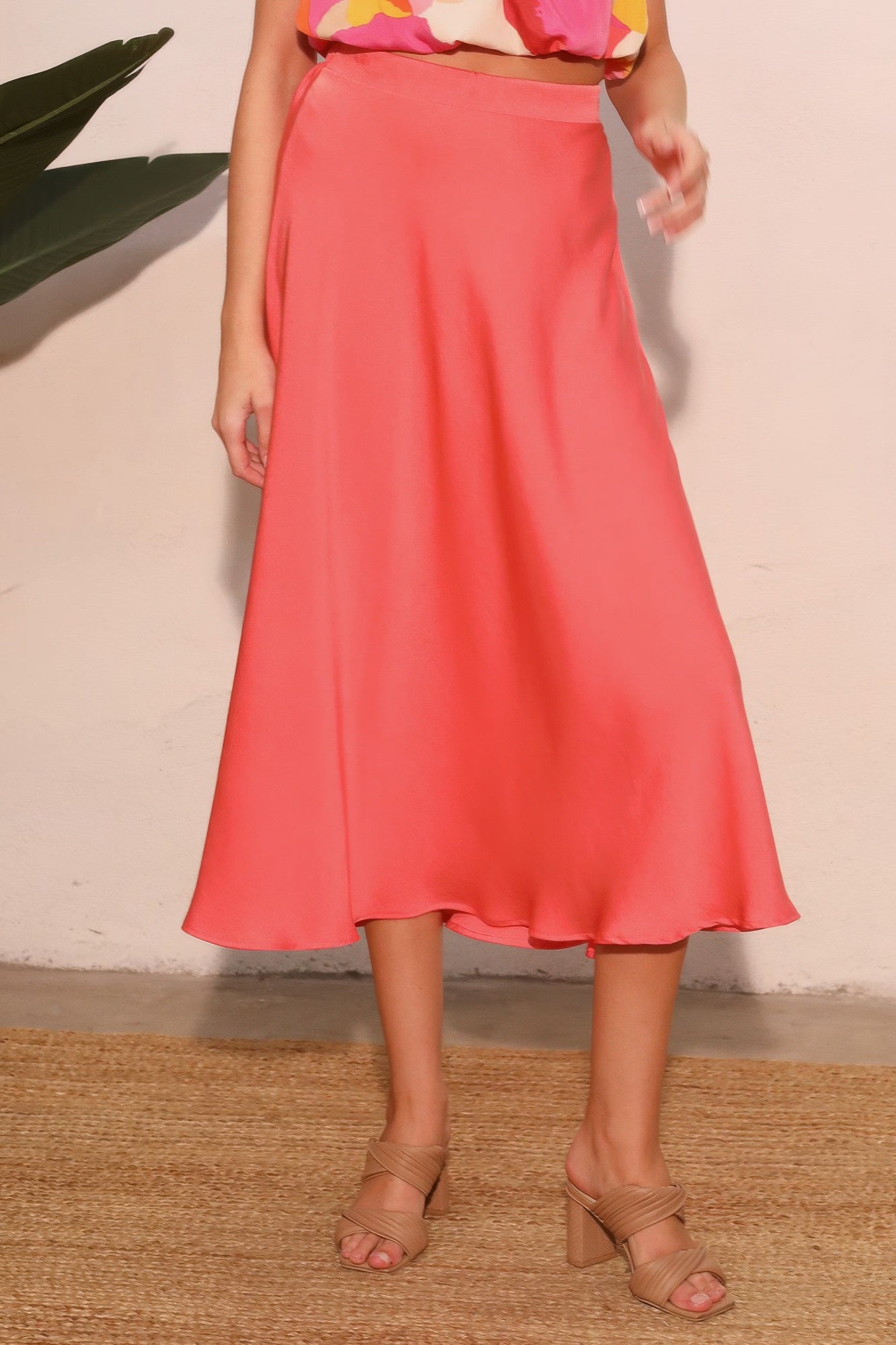 Coral Soleil Satin A-Line Midi Skirt with a floral top and nude heels