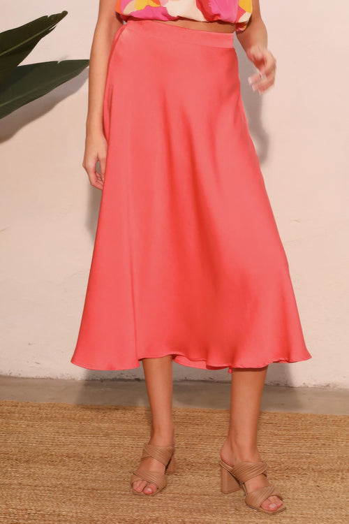 Coral Soleil Satin A-Line Midi Skirt with a floral top and nude heels