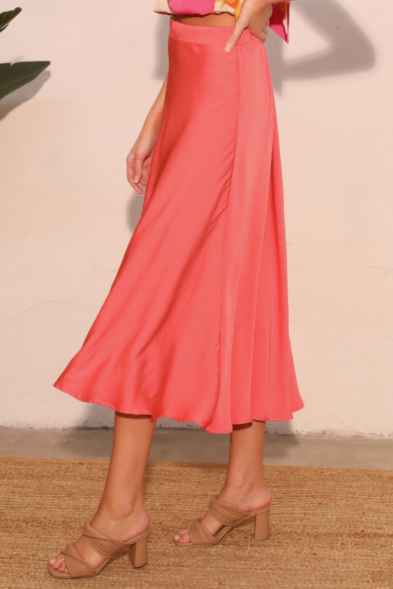 Coral Soleil Satin A-Line Midi Skirt with beige heeled sandals