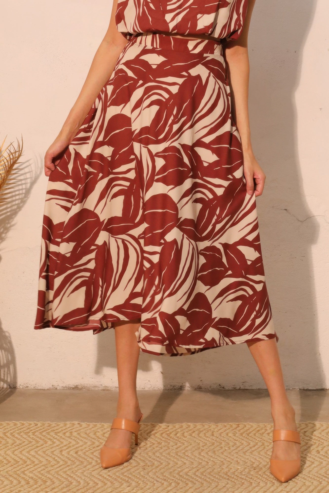 Desert Clay Botanical Midi Skirt with a red and white leaf pattern