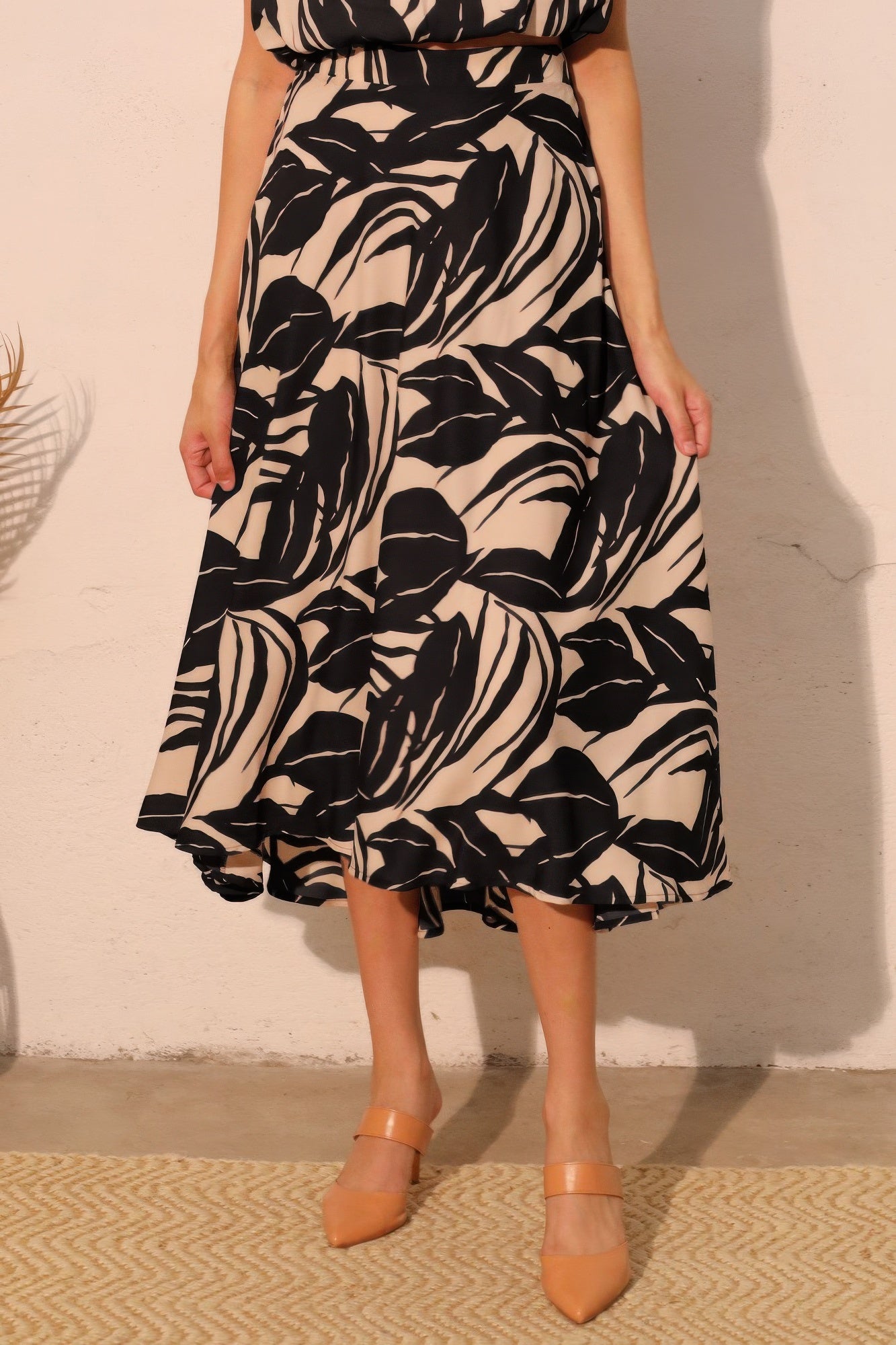 Ink Black Botanical Fluid Midi Skirt with black and cream botanical print