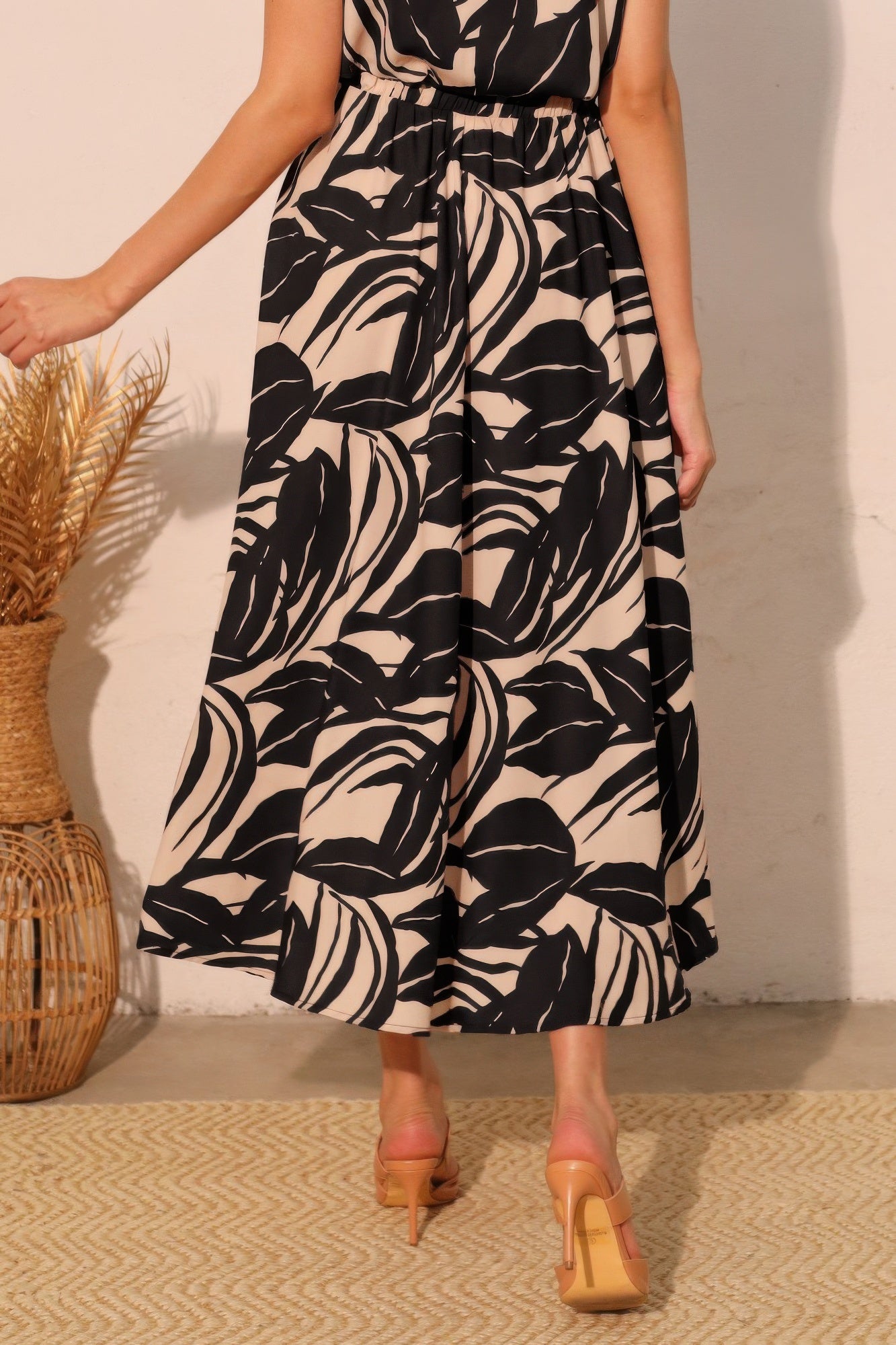 Ink Black Botanical Fluid Midi Skirt with black and beige leaf pattern