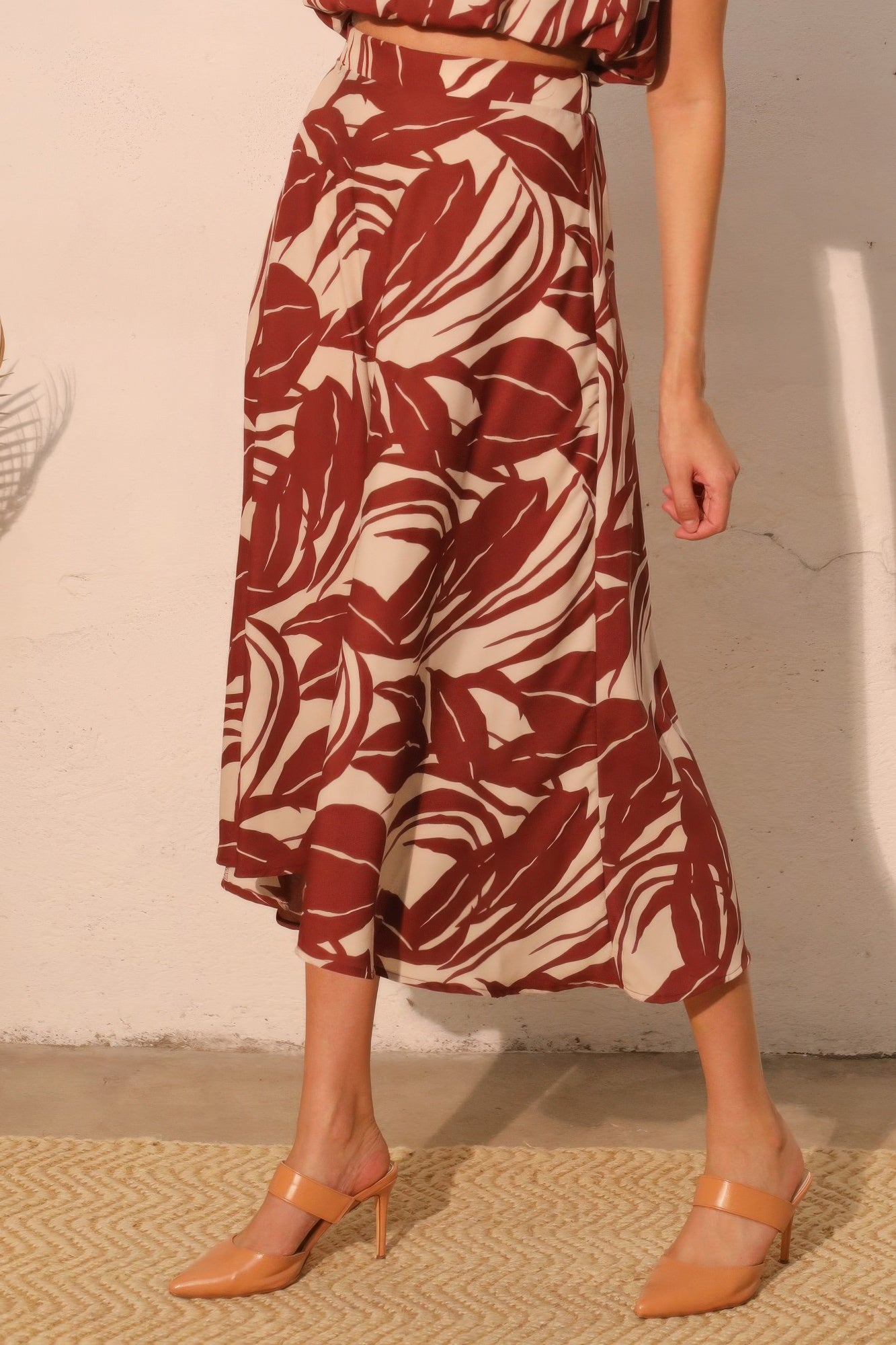 Desert Clay Botanical Midi Skirt with a red and white leaf pattern