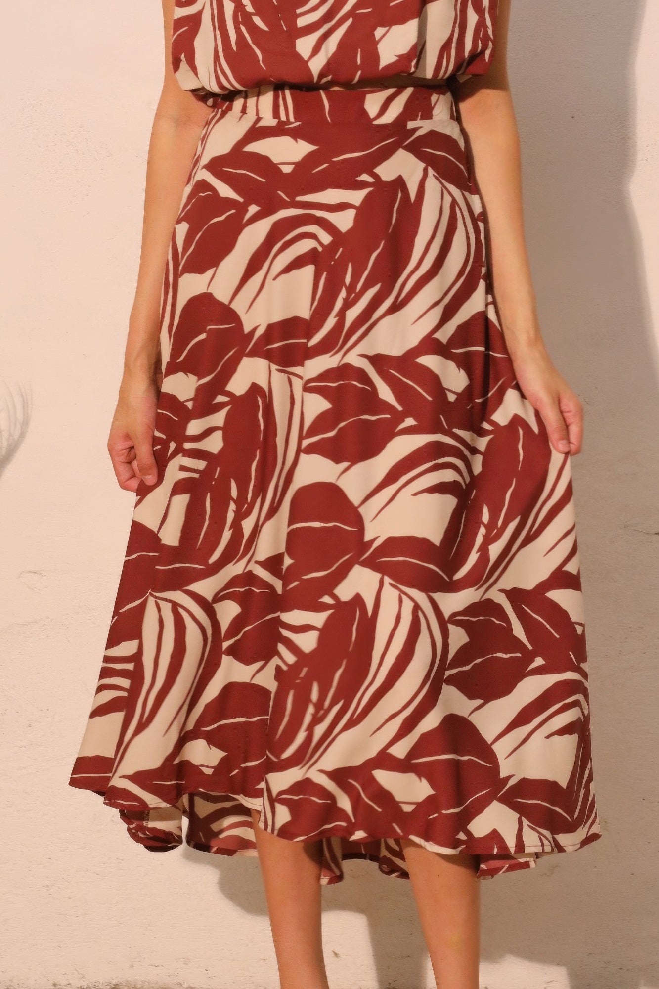Desert Clay Botanical Midi Skirt with a red and white leaf pattern
