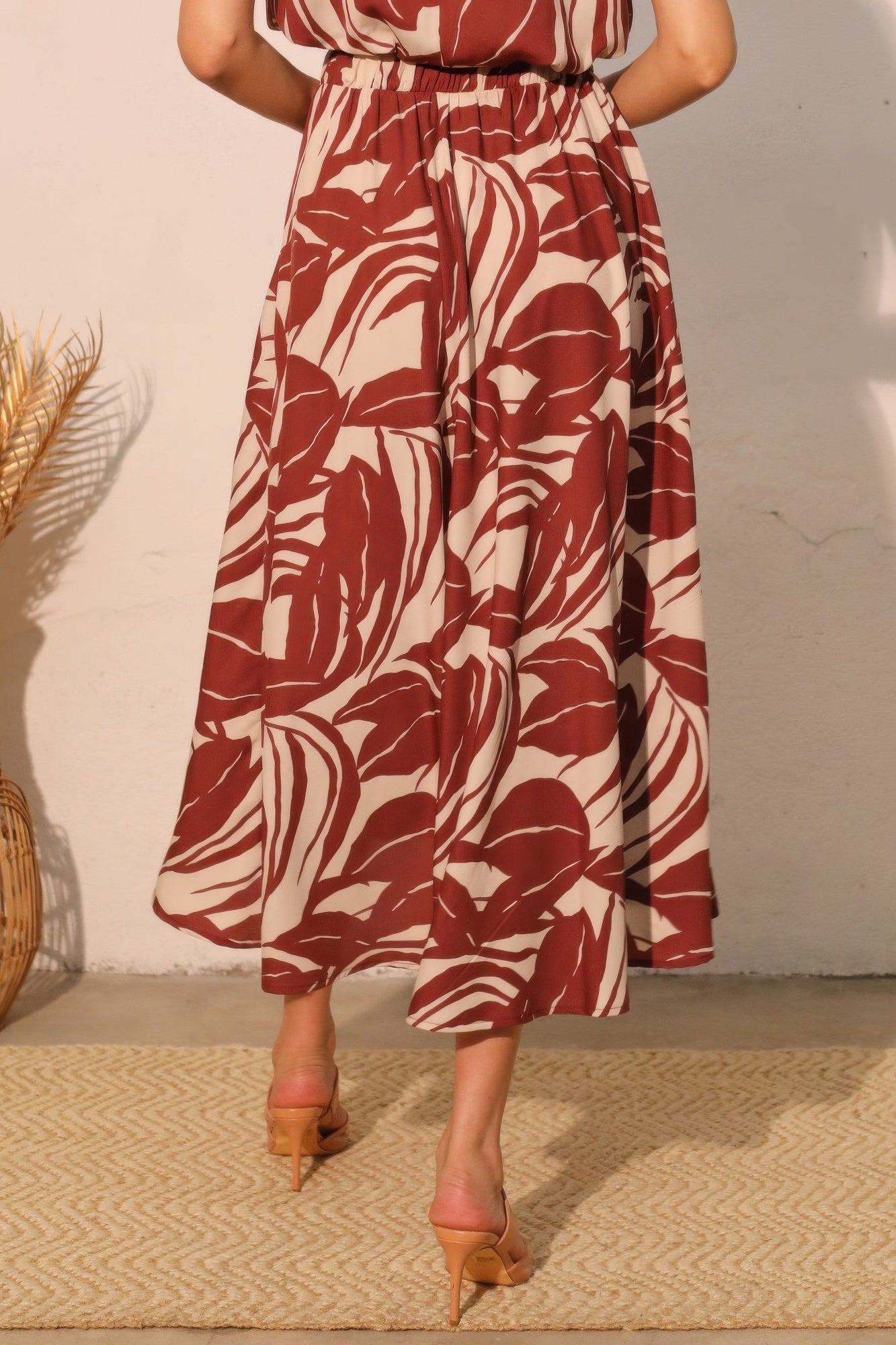 Desert Clay Botanical Midi Skirt with a red and white leaf pattern
