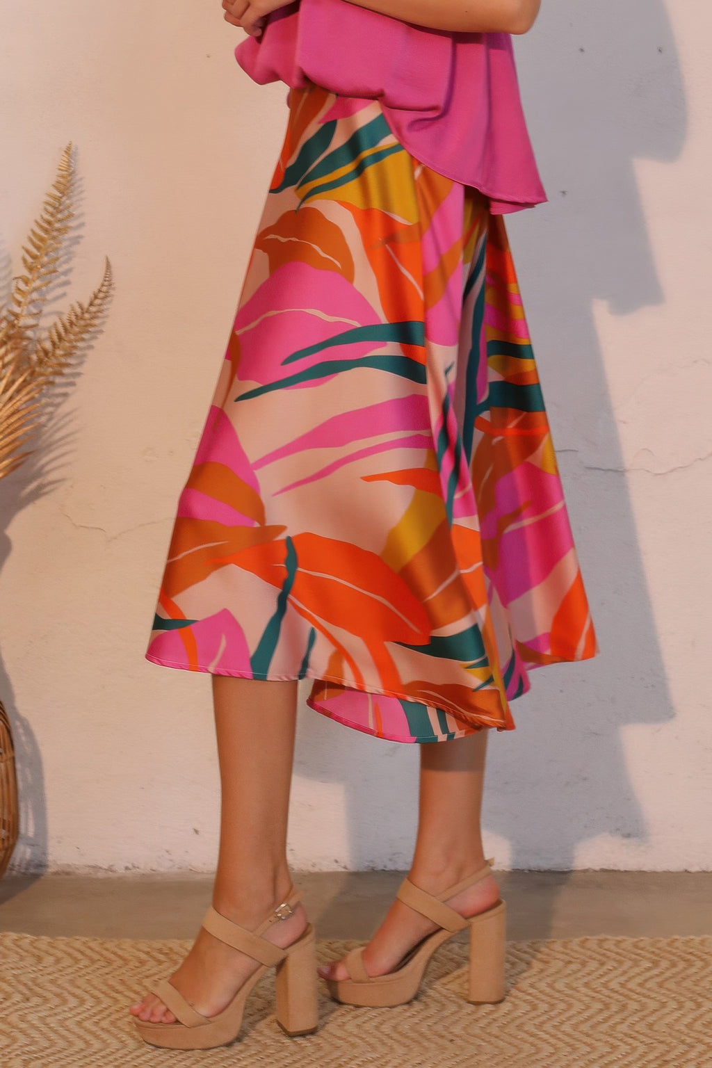 Sunset Bloom Abstract Fluid Midi Skirt with a pink top and nude platform heels