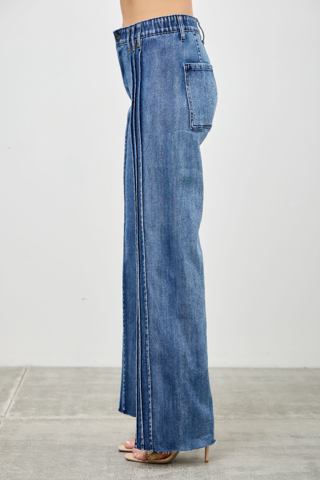 High Rise Straight Jeans with Front Line Detail in blue denim, worn by a model