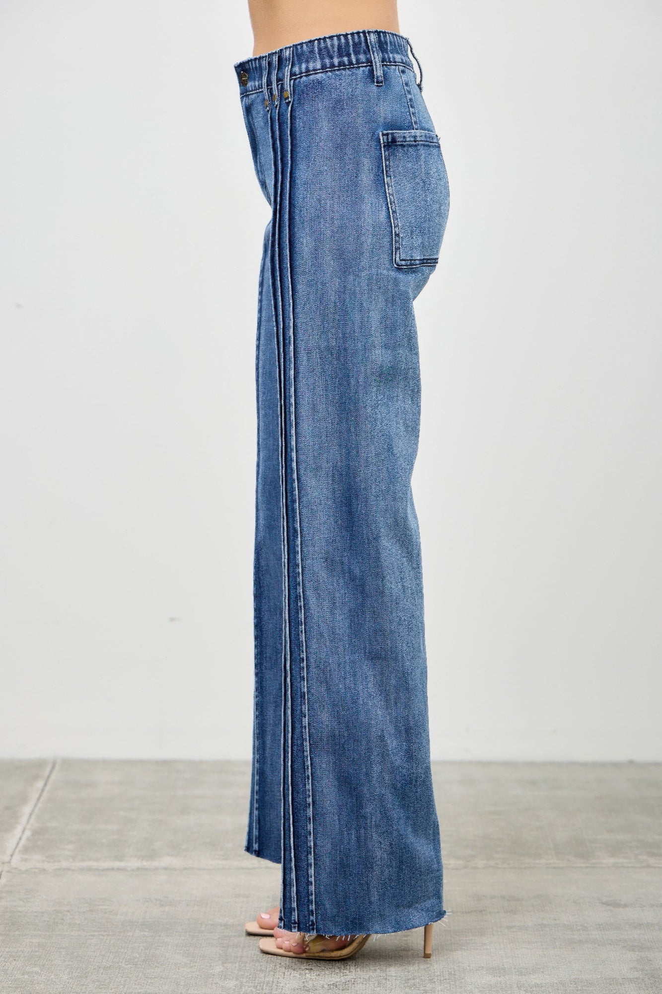 High Rise Straight Jeans with Front Line Detail in blue denim, worn by a model