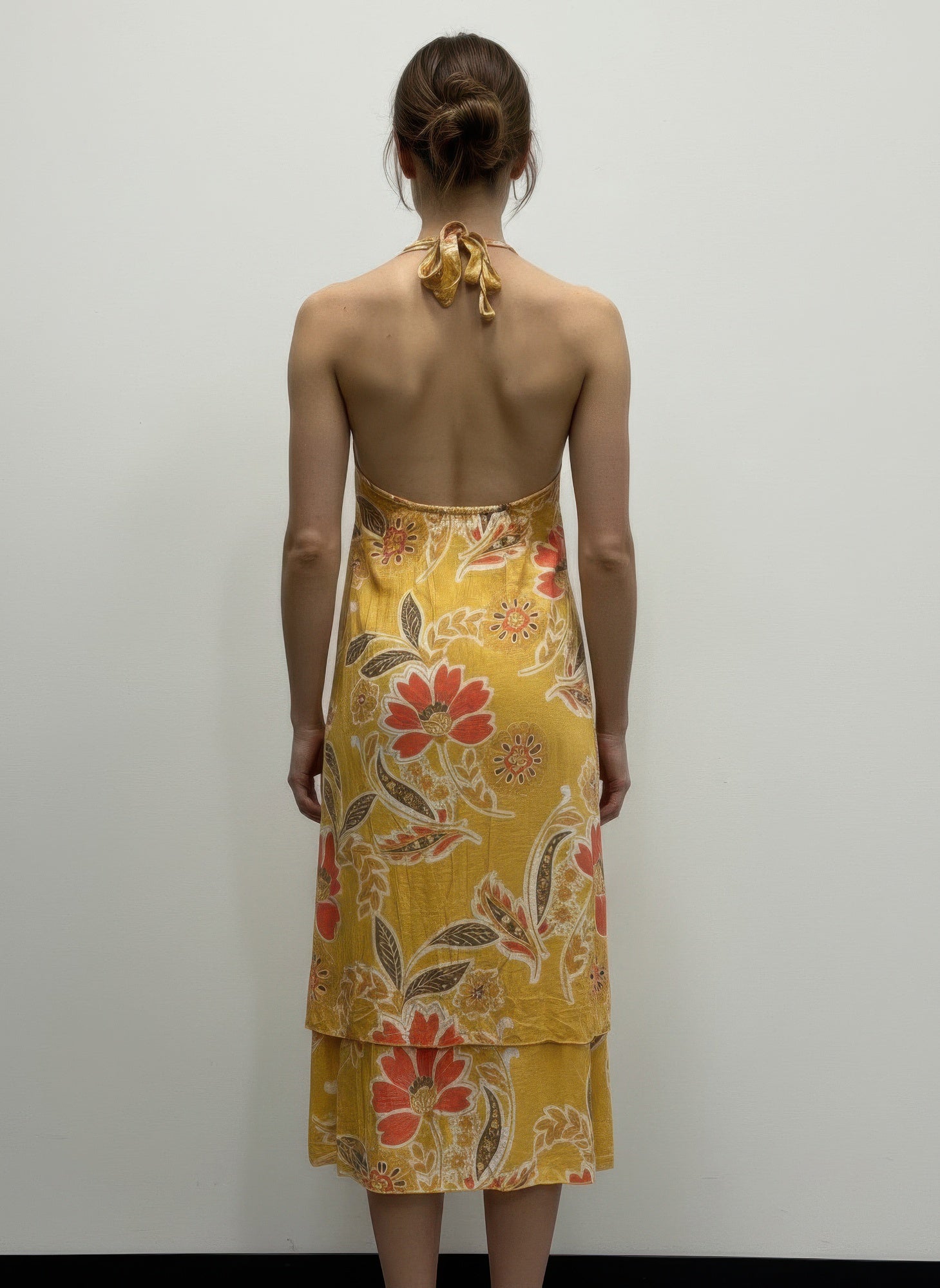 Back of Golden Marigold Floral Halter-Neck Dress with open back and floral print