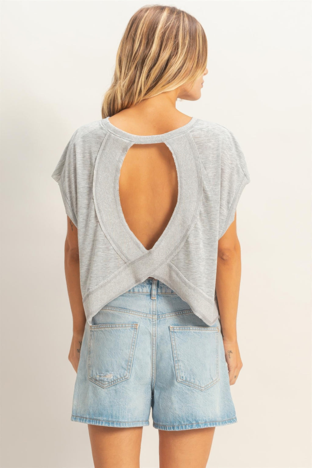 Silver Cloud Boxy Cropped Tee with open back detail and light wash denim shorts